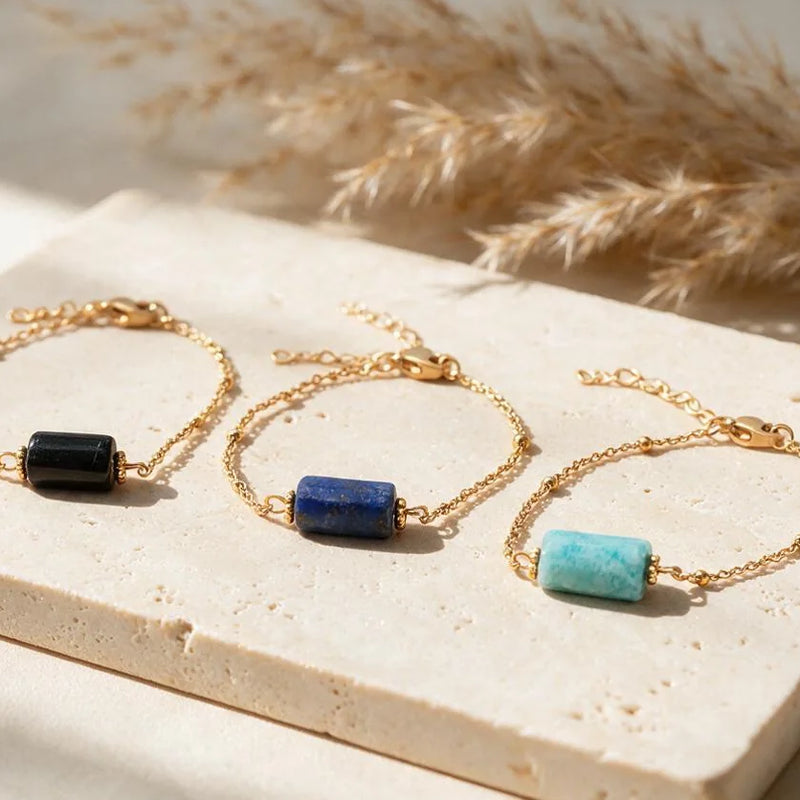 Bracelets LINE®, pierre tube sur chaîne dorée, sur travertin
