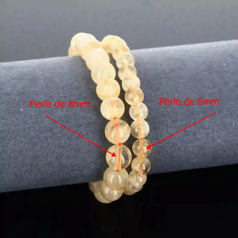 Détail perles jaunes lumineuses du bracelet pierre naturelle Citrine véritable. Qualité lithothérapie pour créativité et chakra sacré.