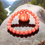Détail perles chaudes oranges du bracelet pierre naturelle Cornaline véritable. Qualité lithothérapie pour courage et énergie.