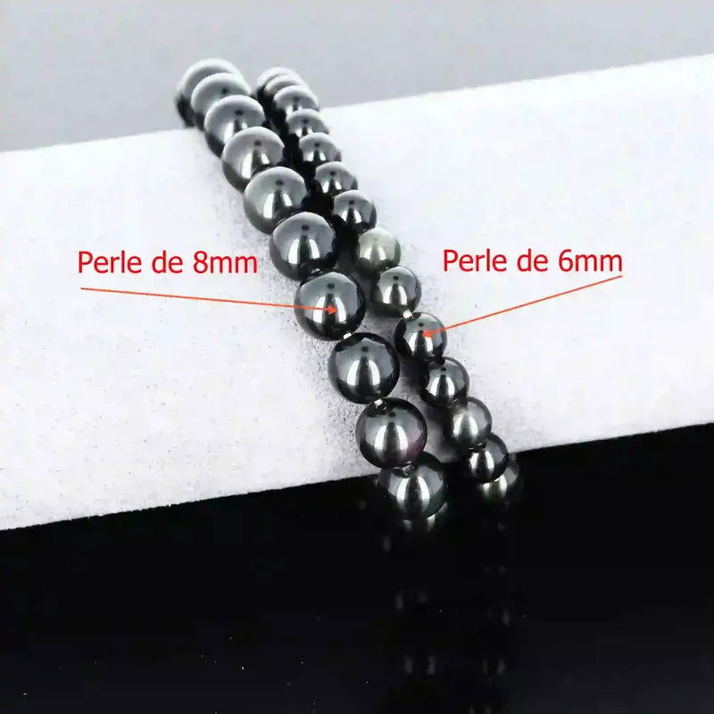 Bracelet de lithothérapie en Obsidienne Œil Céleste (Arc-en-Ciel) véritable porté, bijou pierre naturelle protectrice pour chakra racine.