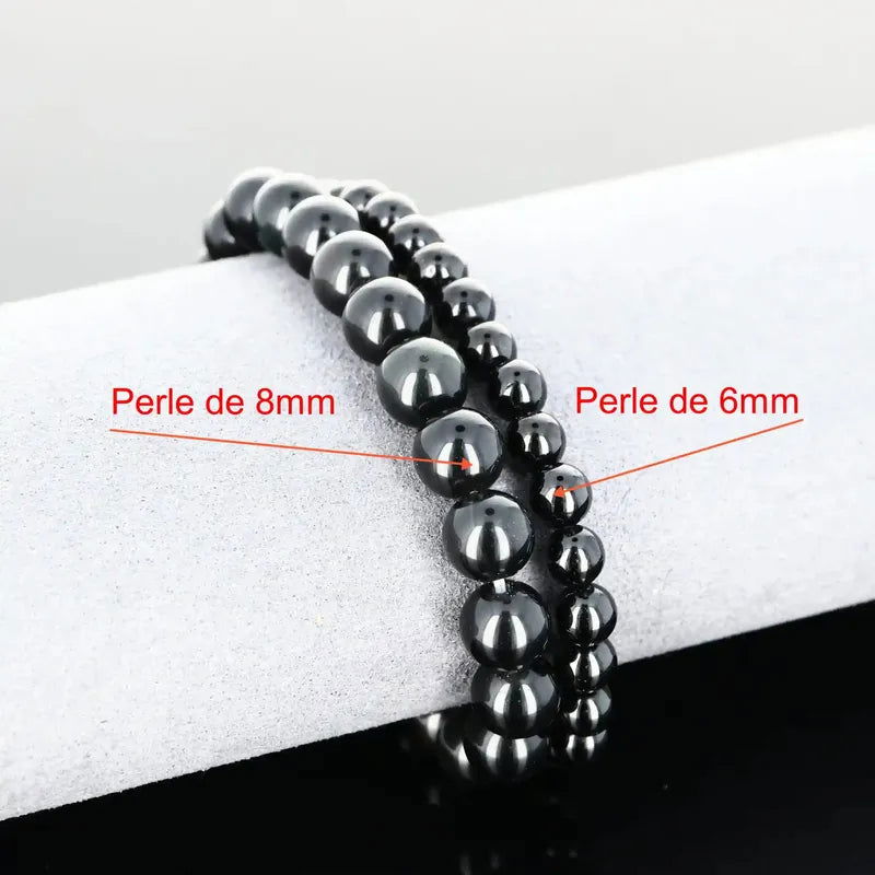 Détail perles noires lisses du bracelet pierre naturelle Onyx Noir véritable. Qualité lithothérapie pour chakras racine/plexus/3e œil.