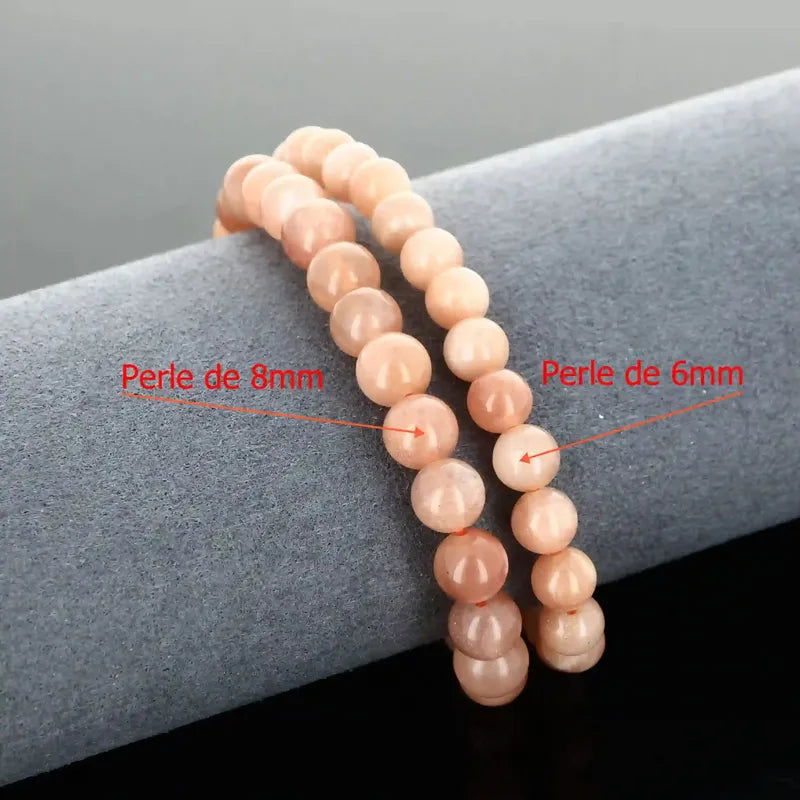 Détail perles orangées pailletées du bracelet pierre naturelle Pierre de Soleil véritable. Qualité lithothérapie pour vitalité et bonne fortune.