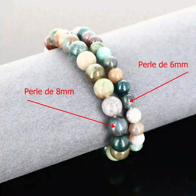 Détail perles aux motifs uniques du bracelet pierre naturelle Agate Indienne véritable. Qualité lithothérapie pour méditation et protection émotionnelle.