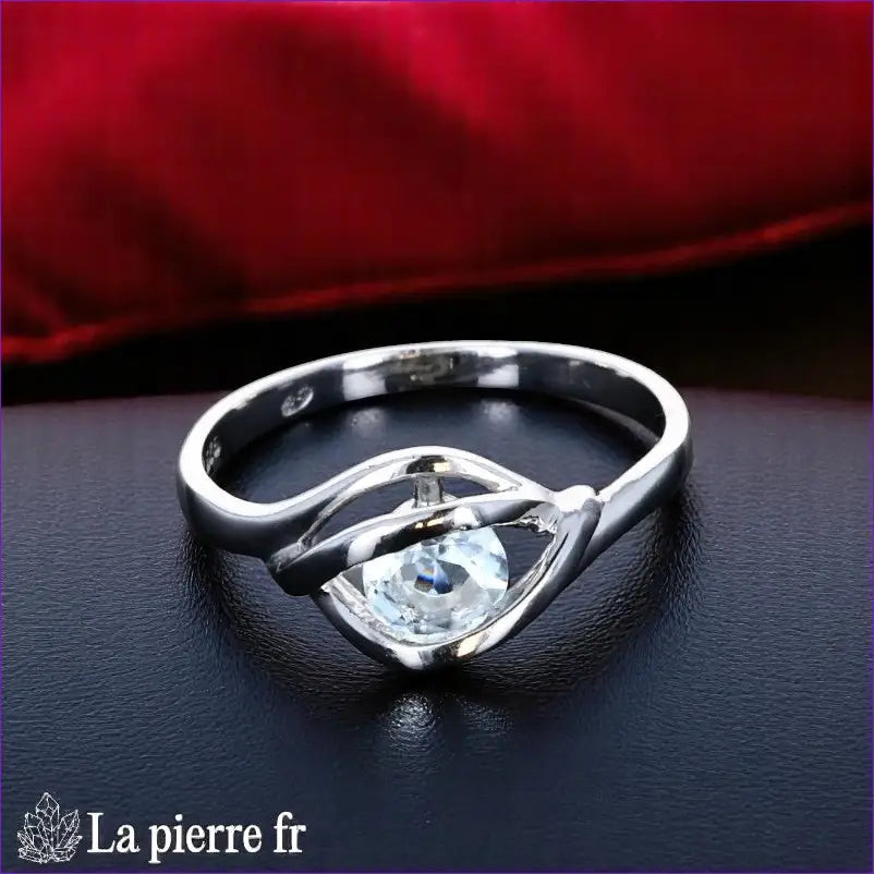 Bague Aigue-Marine (Éclat Solitaire Rond) en argent rhodié, pierre ronde 5mm - Vue de dessus, style minimaliste.