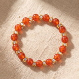 Bague Cornaline MIRÉA®, Perles Orange et Dorées en Double Rang, Élastique