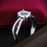 Bague en Quartz rose (Éclat Pavé) — face avant, pavée de 12 zircons, monture rhodiée élégante