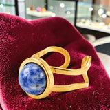 Bague double anneau en Sodalite DUALIS®, acier doré