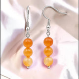 Boucles d'Oreilles Cornaline SPHERA® – 3 boules 6 mm, acier argenté