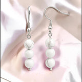 Boucles d'Oreilles Howlite blanche SPHERA® – 3 boules 6 mm, acier argenté