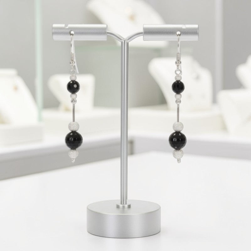 Détail contraste onyx noir et perles argent diamantées boucles Mintaka