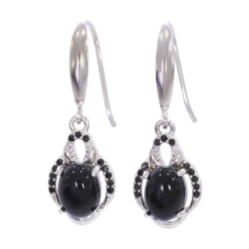 Paire de boucles d'oreilles onyx noir Menkent sur fond blanc, argent 925 rhodié