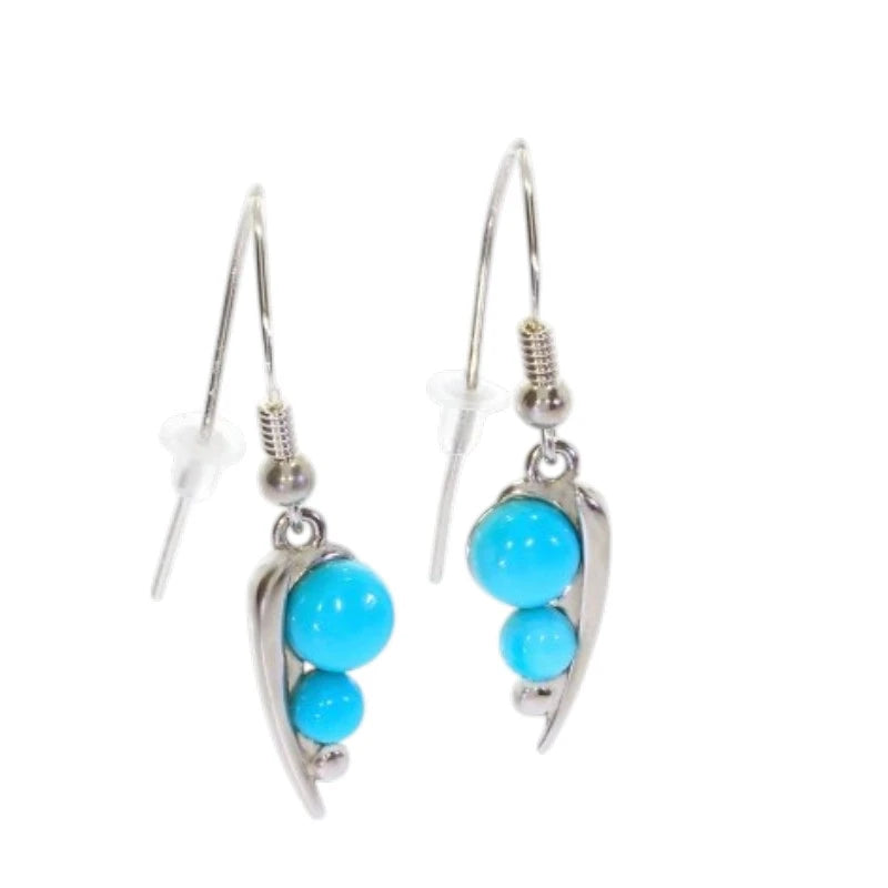 Paire de boucles d'oreilles turquoise Alphard sur fond blanc, argent 925 rhodié