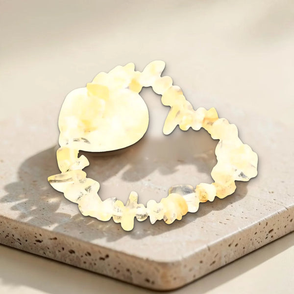 Bracelet citrine et sa pierre roulée sur travertin, vraie photo de pépites jaune doré