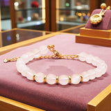 Bracelet Cristal de roche AURA® – perles 6 mm en pierre naturelle & dorée