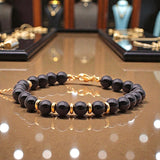 Bracelet Onyx noir AURA® – perles 6 mm en pierre naturelle & dorée