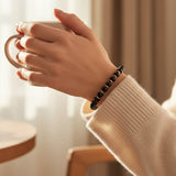 Bracelet Onyx noir AURA® – perles 6 mm en pierre naturelle & dorée