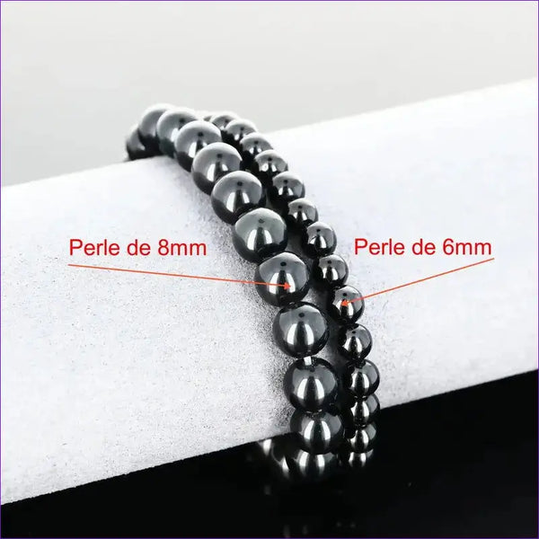 Détail perles noires lisses du bracelet pierre naturelle Onyx Noir véritable. Qualité lithothérapie pour chakras racine/plexus/3e œil.