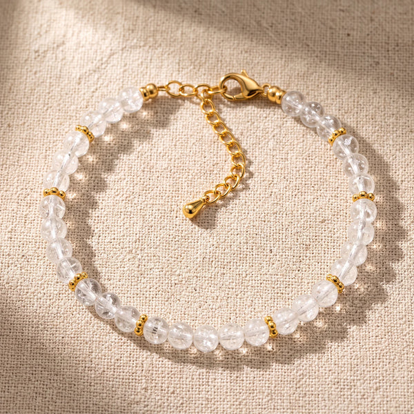 Bracelet pierre naturelle blanche ORÉLIA® en perles de cristal de roche de 4 mm, rondelles fleurs dorées