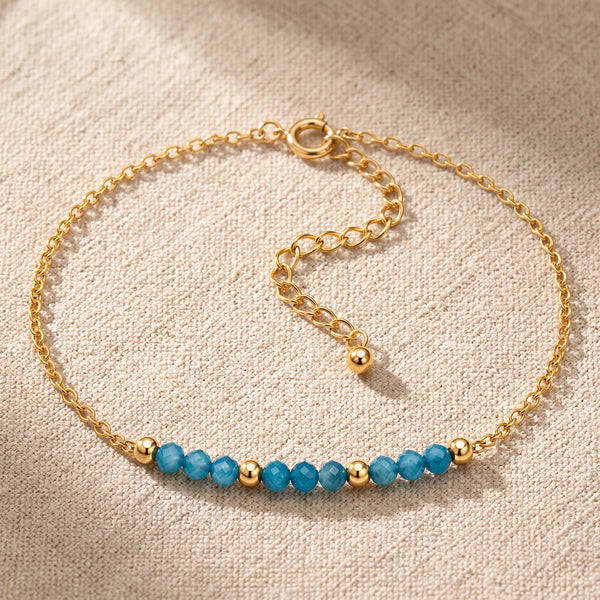 Bracelet pierre naturelle bleue FILÉA®, perles d'apatite bleue facettées sur chaîne fine dorée