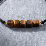 Bracelet Œil de Tigre KUBIK®, Perles Cubes Marron sur Cordon Coulissant Noir
