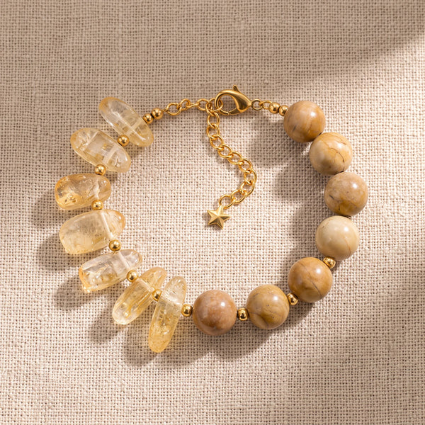 Bracelet pierre naturelle jaune DUALIA® en citrine chauffée et bois fossile jaune, chaîne dorée réglable