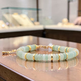 Bracelet perles plates en Aventurine verte DISQUE®, acier doré