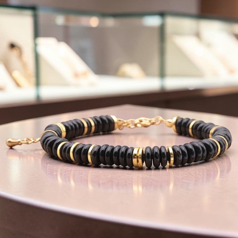 Bracelet perles plates en Onyx noir DISQUE®, acier doré