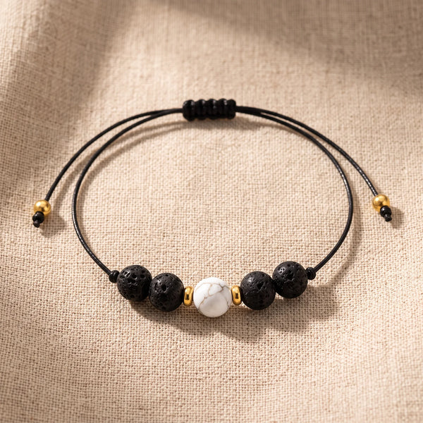 Bracelet pierre naturelle noire VOLCANA® en howlite et pierre de lave, cordon coulissant