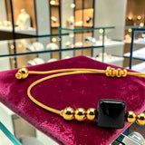Bracelet cordon doré en Onyx noir CUBE®, pierre cube 8 mm