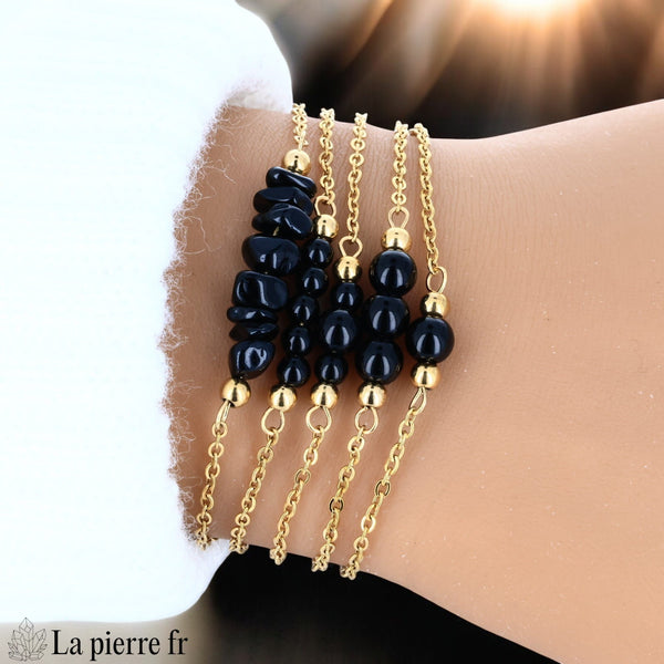 Bracelet en onyx noir au poli miroir sur chaîne dorée en acier inoxydable