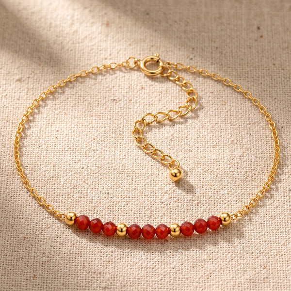 Bracelet pierre naturelle orange FILÉA®, perles de cornaline facettées sur chaîne fine dorée