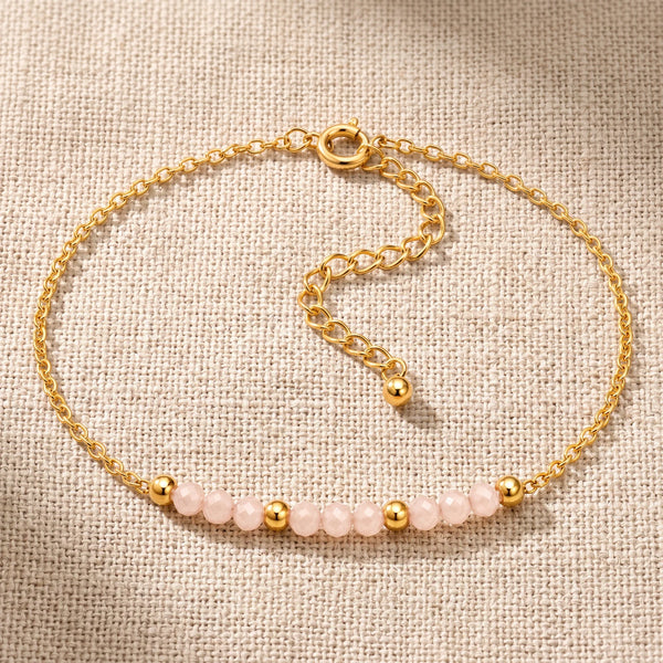 Bracelet pierre naturelle rose FILÉA®, perles de pierre de lune rose facettées sur chaîne fine dorée