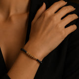 Bracelet fin en Spinelle noir FINA®, perles facettées et acier doré