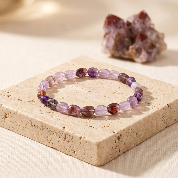 Bracelet auralite 23 véritable, pierres roulées violettes aux inclusions brunes sur élastique