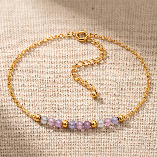 Bracelet pierre naturelle violette FILÉA®, perles de fluorine facettées sur chaîne fine dorée