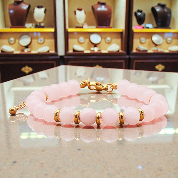 Bracelet Quartz rose AURA® en perles de pierre naturelle 6 mm avec montage doré