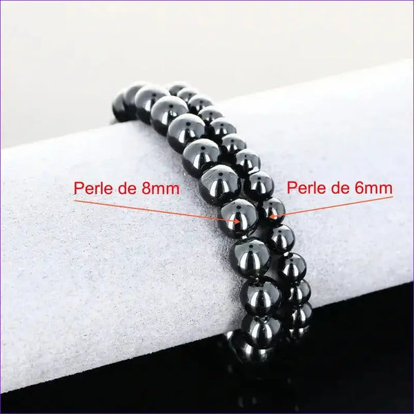 Authentique bracelet lithothérapie Tourmaline Noire (6/8mm). Protection énergétique, ancrage profond et stabilité émotionnelle.