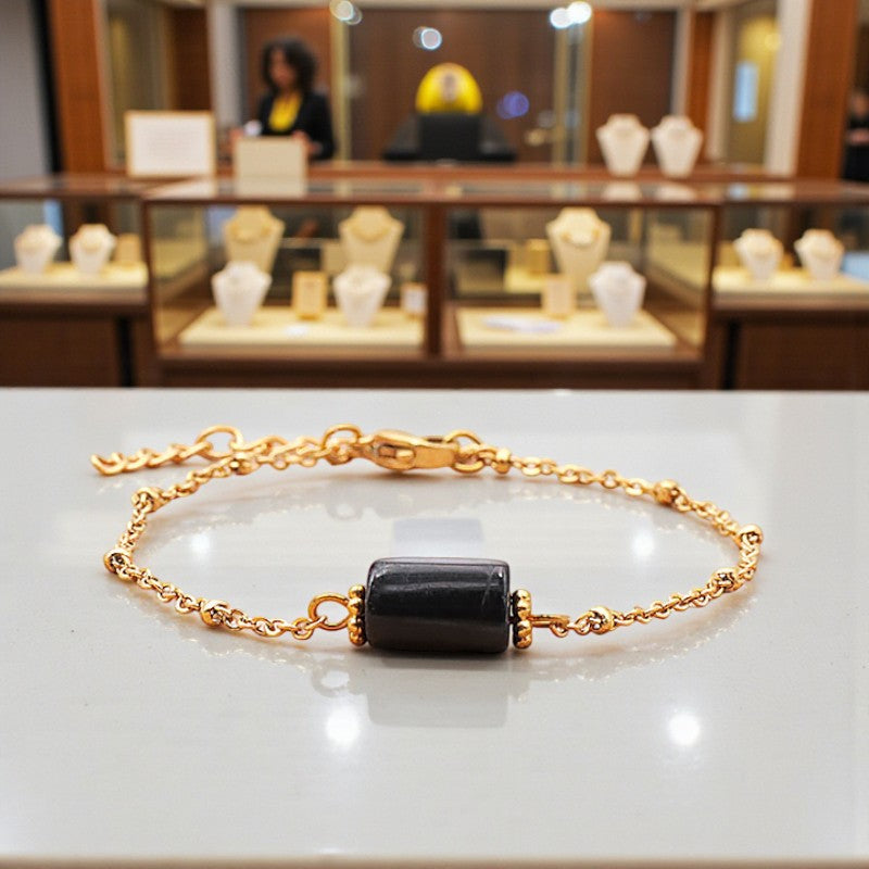 Bracelet Tourmaline noire LINE® en pierre noire tube facettée sur chaîne dorée