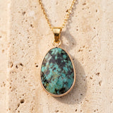 Collier Turquoise Africaine FACETTA®, Pendentif Bleu-Vert Ovale Doré