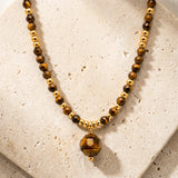 Collier Œil de Tigre PERLÉA®, Perles Facettées sur Acier Doré Femme