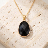 Collier Pierre Noire en Obsidienne FACETTA®, Pendentif Ovale Doré