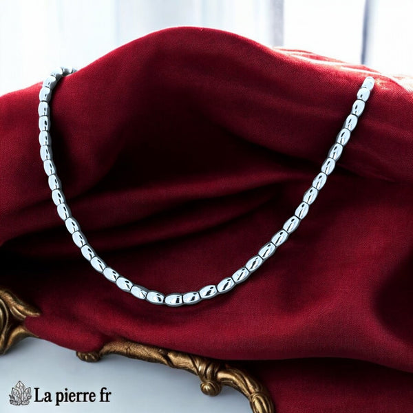Détail des perles olive en hématite polie au gris métallique