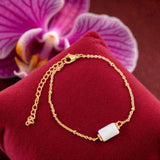 Bracelet Aigue-marine LINE® – pierre bleue tube facettée sur chaîne dorée