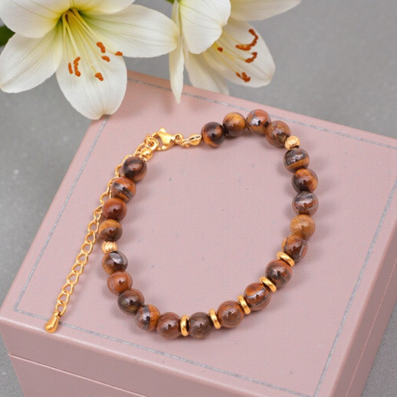 Détail des perles rondes 6 mm en Œil de tigre naturel du bracelet AURA®