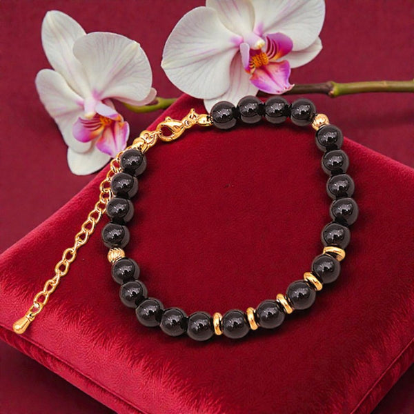 Détail des perles rondes 6 mm en Onyx noir naturel du bracelet AURA®