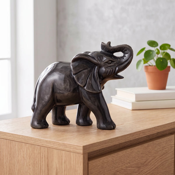 Éléphant noir argenté en obsidienne argentée posé sur une console en bois