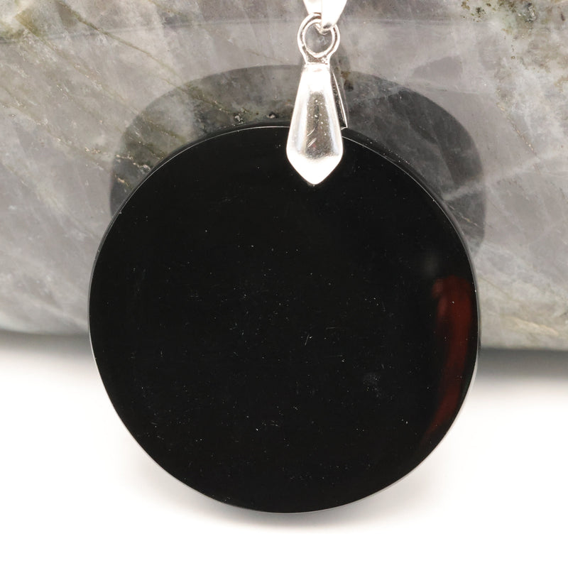 Gravure du triskell sur un disque d'obsidienne noire du Mexique