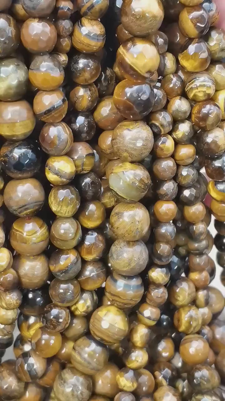 Vidéo des perles d'œil de tigre facettées sur fil de 36 cm