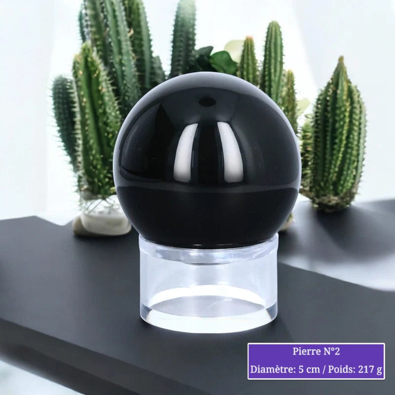 Détail de la sphère d'Obsidienne Œil Céleste, pierre naturelle noire irisée polie