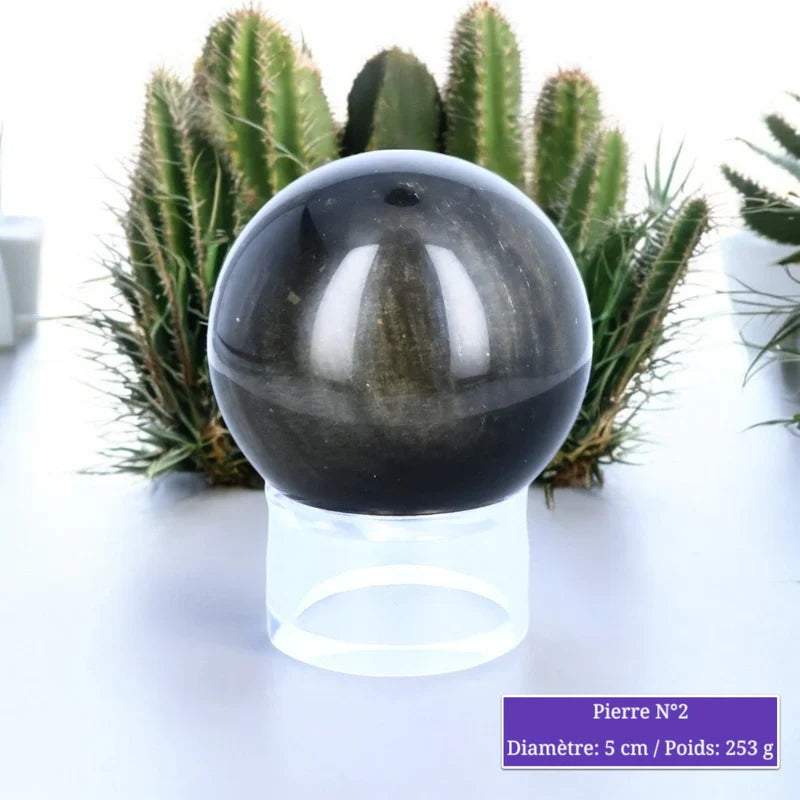 Détail de la sphère d'Obsidienne Dorée, pierre naturelle noire dorée polie